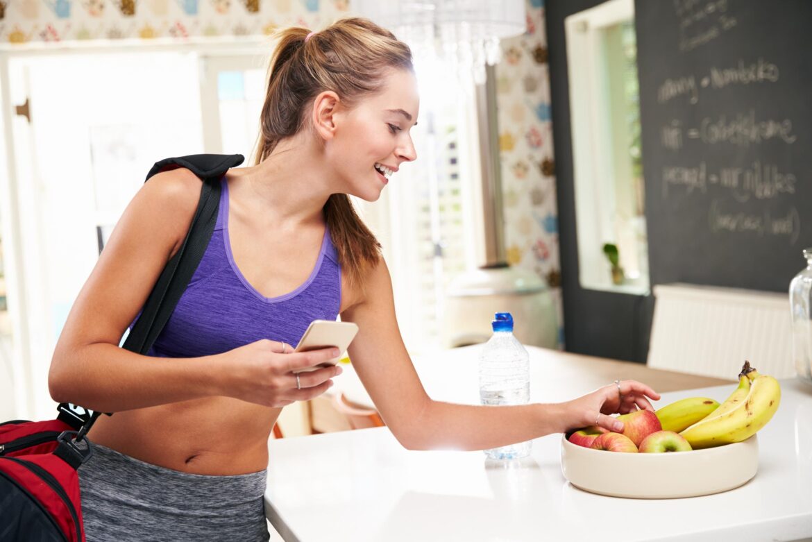 Young woman eating a oatmeal after a workout